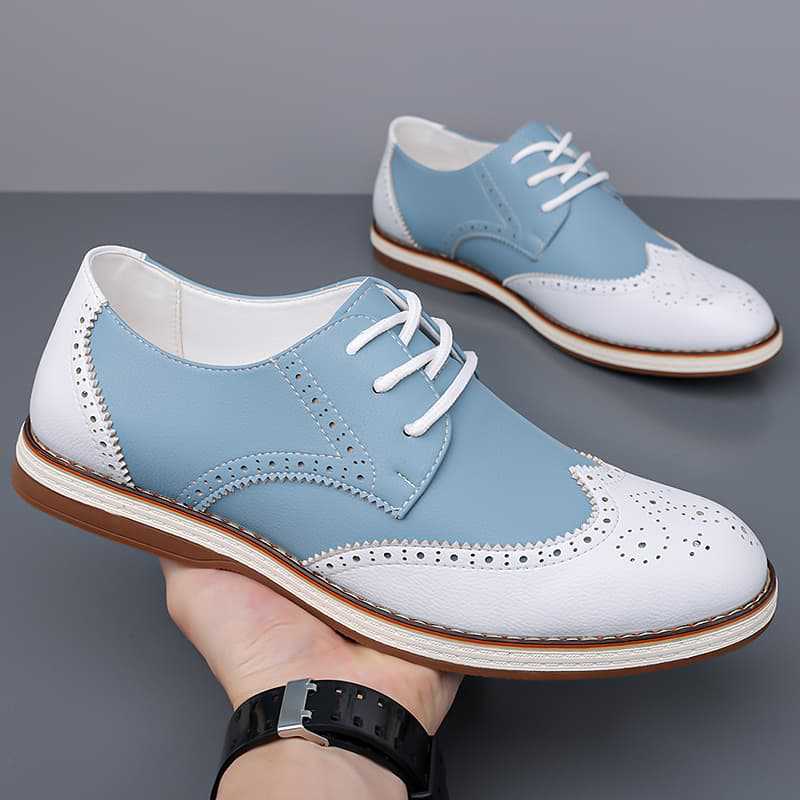 Detailed close-up of men's classic brogue dress shoes, showcasing intricate perforations & premium leather.