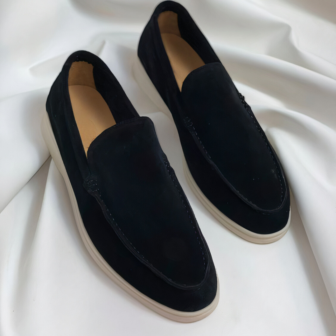 Classic black leather men's slip-on loafers, perfect for versatile everyday style and comfort.