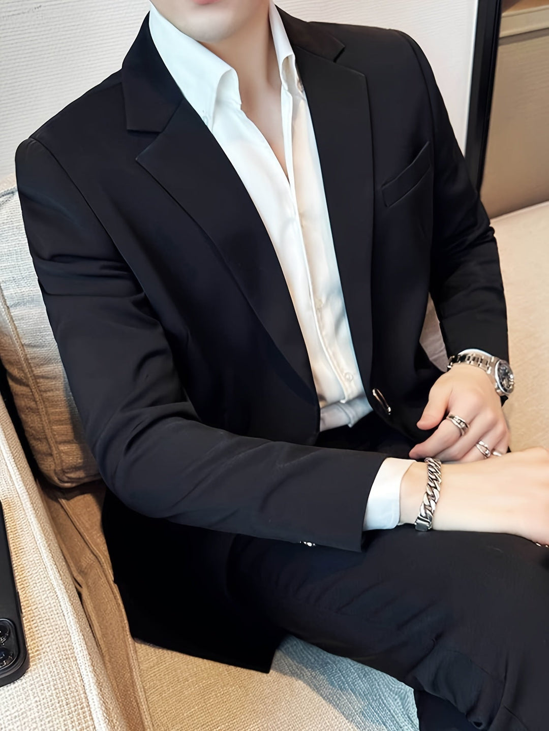 Timeless black men's blazer, a crucial wardrobe essential for a polished and sophisticated men's fashion statement.