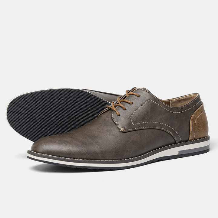 Close-up of polished leather men's Derby shoes, showcasing the exquisite craftsmanship & classic style.
