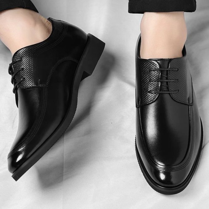 Men's classic dress shoes paired with a suit, showcasing sophisticated men's fashion and elegant style.