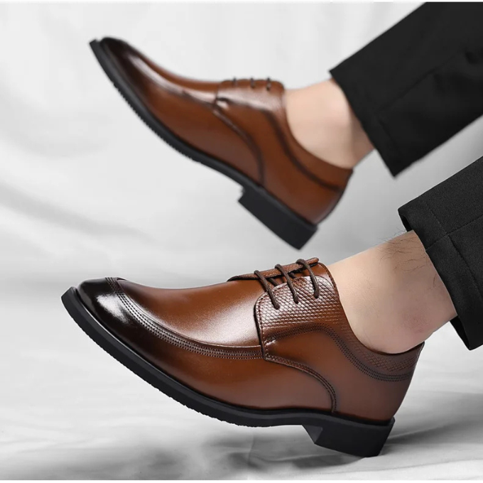 Close-up of the luxurious leather texture on men's elegant dress shoes, emphasizing classic design.