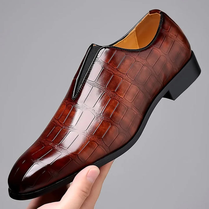 Classic black men's loafers, perfect slip-on dress shoes for formal or stylish everyday wear.