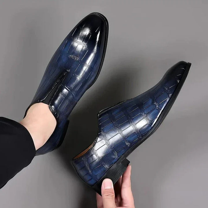Elegant men's blue loafers, a comfortable and stylish slip-on shoe for modern outfits.