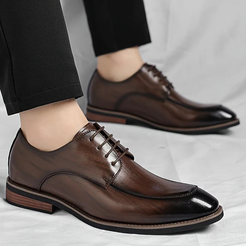 Close-up of premium leather men's Oxford shoes, showcasing details for sophisticated formal & business wear.