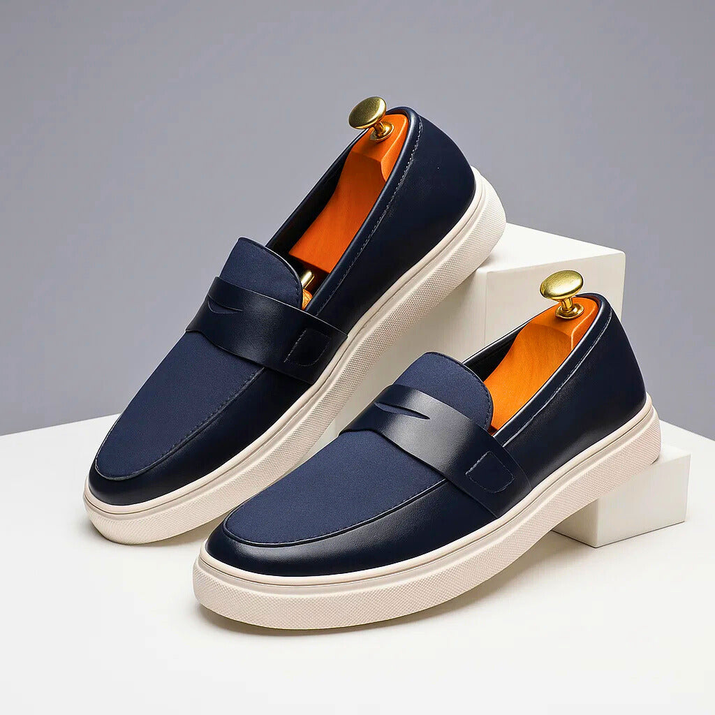 Stylish navy men's penny loafers, versatile casual footwear for classic everyday wear & comfort.