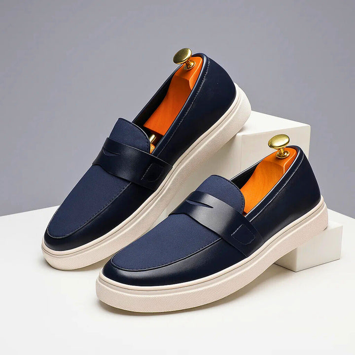 Stylish navy men's penny loafers, versatile casual footwear for classic everyday wear & comfort.