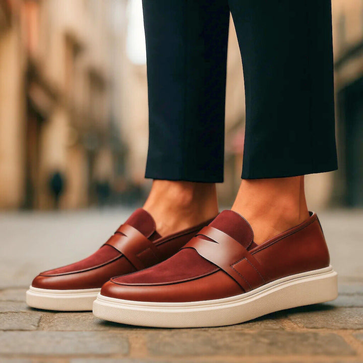 Elegant burgundy men's penny loafers, perfect for adding a touch of classic fashion to any outfit.
