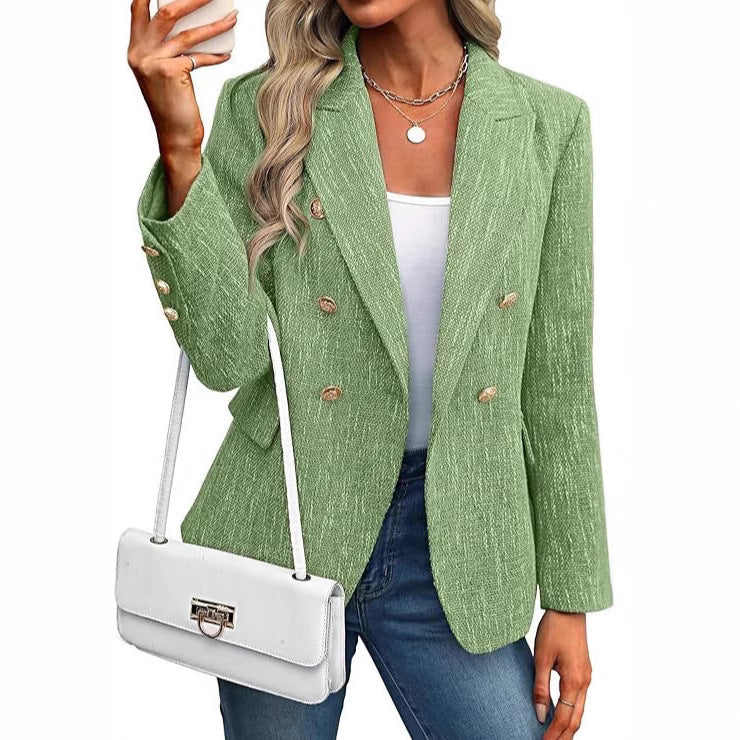 Modern women's double-breasted jacket, styled with radiant gold buttons. Elevates any smart casual outfit.