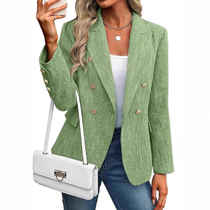 Modern women's double-breasted jacket, styled with radiant gold buttons. Elevates any smart casual outfit.