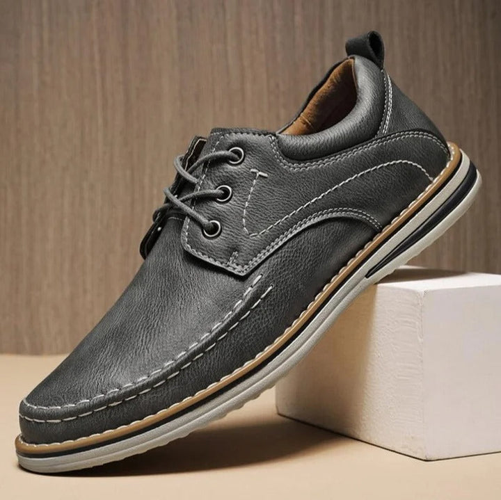 Classic men's brown moc toe oxfords, comfortable, versatile shoes for casual to formal outfits.