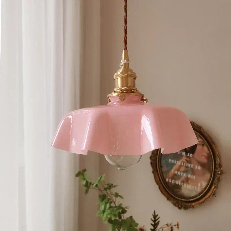 Vintage brass ceiling pendant light, creating a warm, classic French ambiance in your dining room.