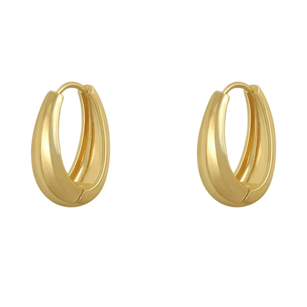 Simple yet stunning classic gold hoop earrings, essential everyday jewelry for women seeking timeless elegance.