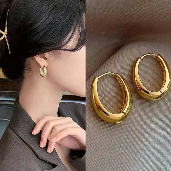 Durable and stylish classic gold hoop earrings, designed for women's comfortable and elegant everyday wear.