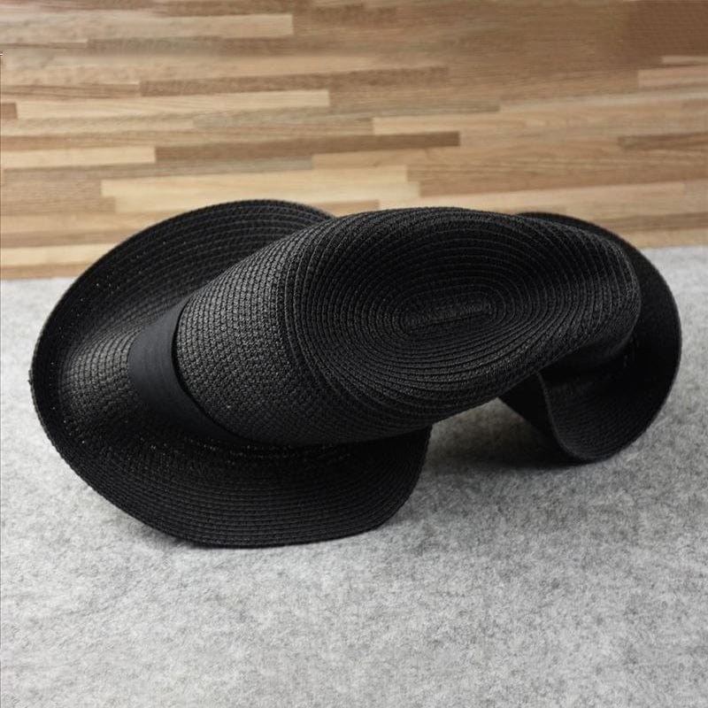 Artisan men's Panama sun hat. Handmade Toquilla straw, classic design, offering lightweight UV protection.