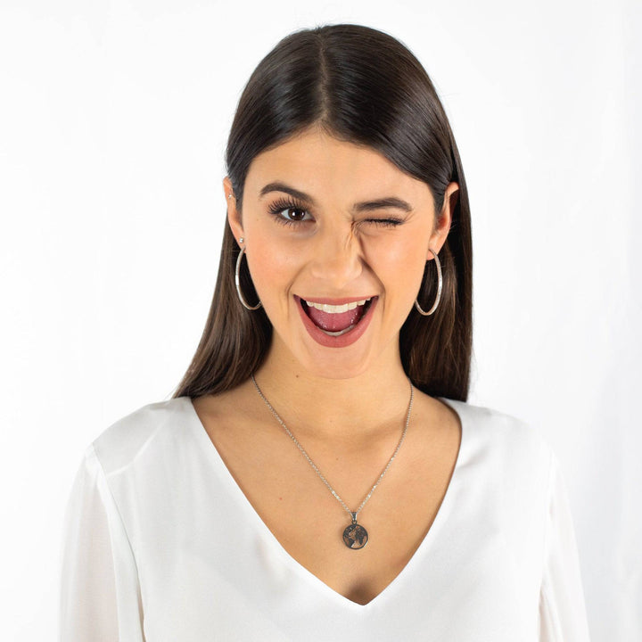 Elegant women's classic large hoop earrings in silver & gold, a timeless fashion jewelry gift.