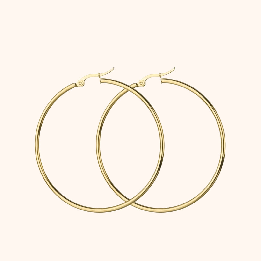Women's sterling silver & gold plated large hoop earrings, a chic and versatile fashion accessory.