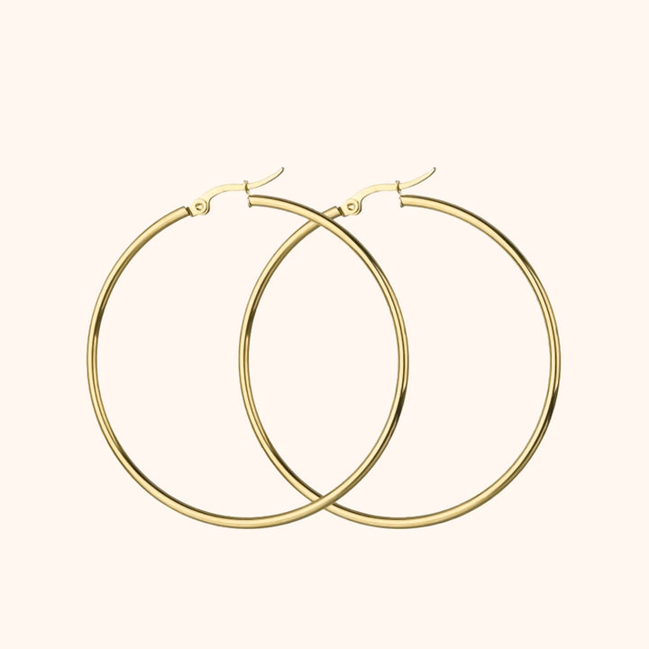 Women's sterling silver & gold plated large hoop earrings, a chic and versatile fashion accessory.