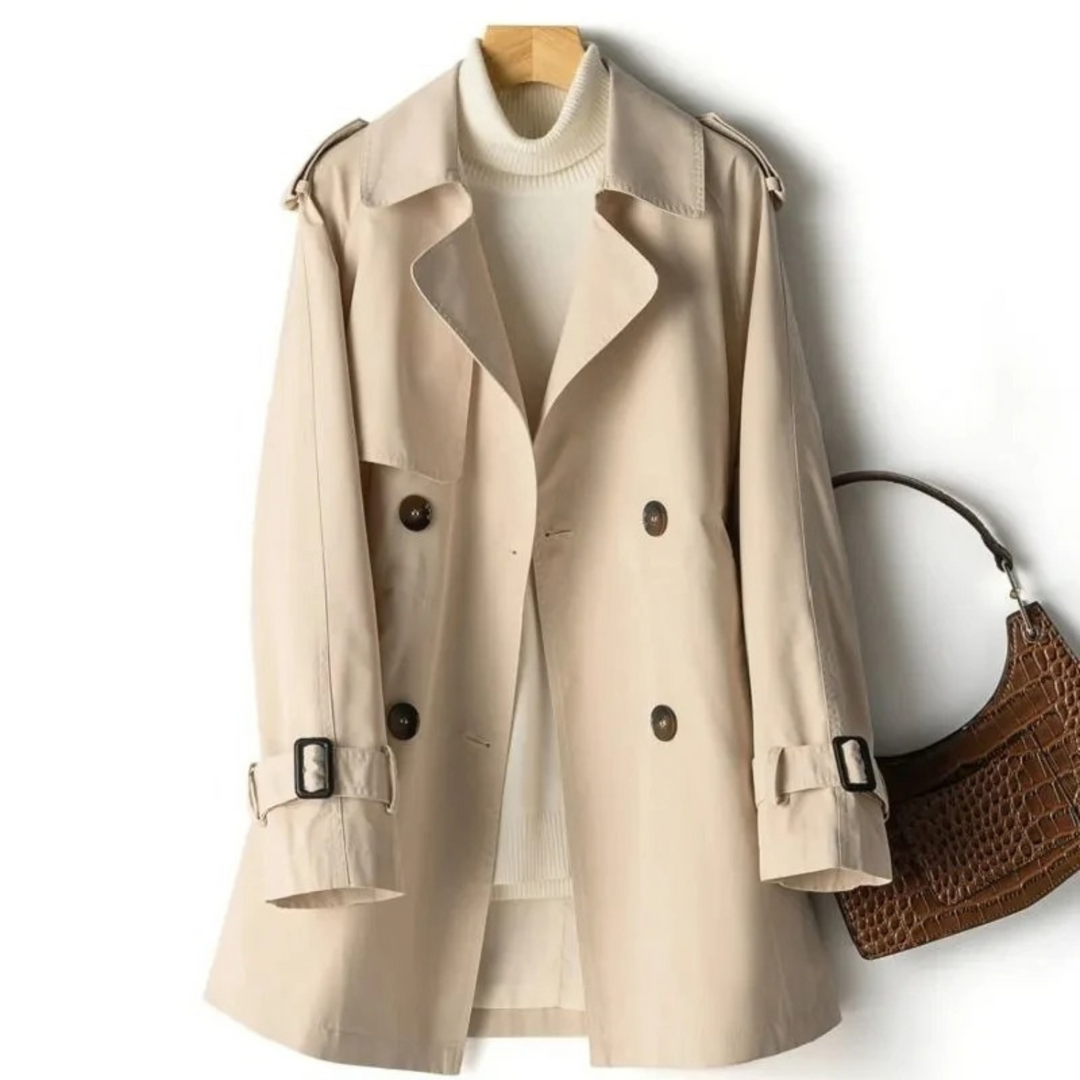 Stylish long women's buttoned trench coat. Classic design, ideal elegant outerwear for fall and spring fashion.