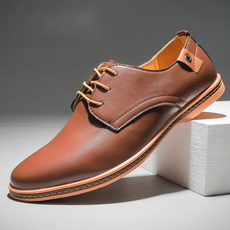 Close-up of premium men's leather lace-up dress shoes, showcasing classic design and quality craftsmanship.