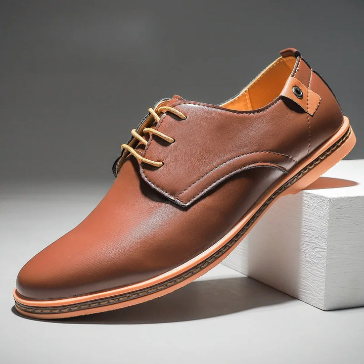 Close-up of premium men's leather lace-up dress shoes, showcasing classic design and quality craftsmanship.