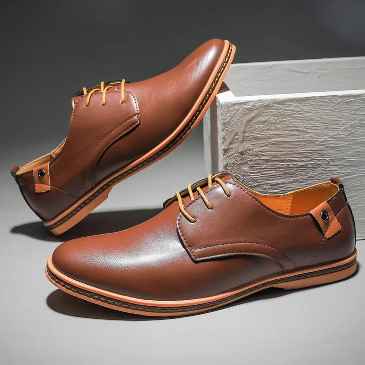 Men's classic leather dress shoes with lace-up closure. Durable and comfortable footwear for any formal occasion.