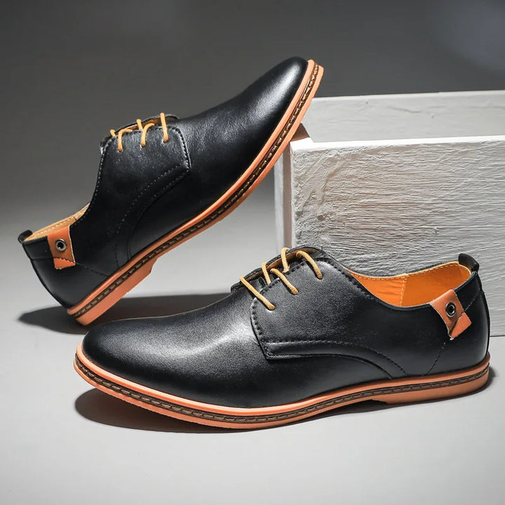 Stylish men's black leather lace-up dress shoes. Perfect for office, weddings, and versatile formal outfits.