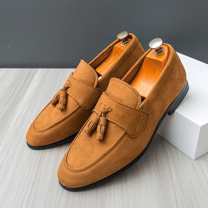 Classic men's black leather tassel loafers, elegant slip-on dress shoes for formal & business casual wear.