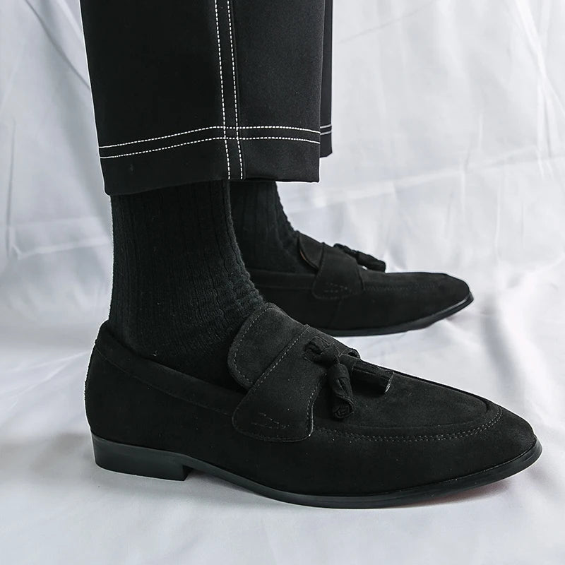 Men's formal black tassel loafers, sleek slip-on dress shoes offering classic style & comfort.