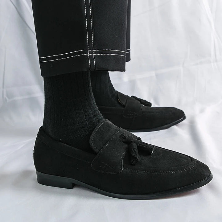 Men's formal black tassel loafers, sleek slip-on dress shoes offering classic style & comfort.