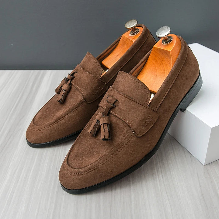 Men's sophisticated slip-on tassel loafers, ideal dress shoes for a refined business or smart casual look.