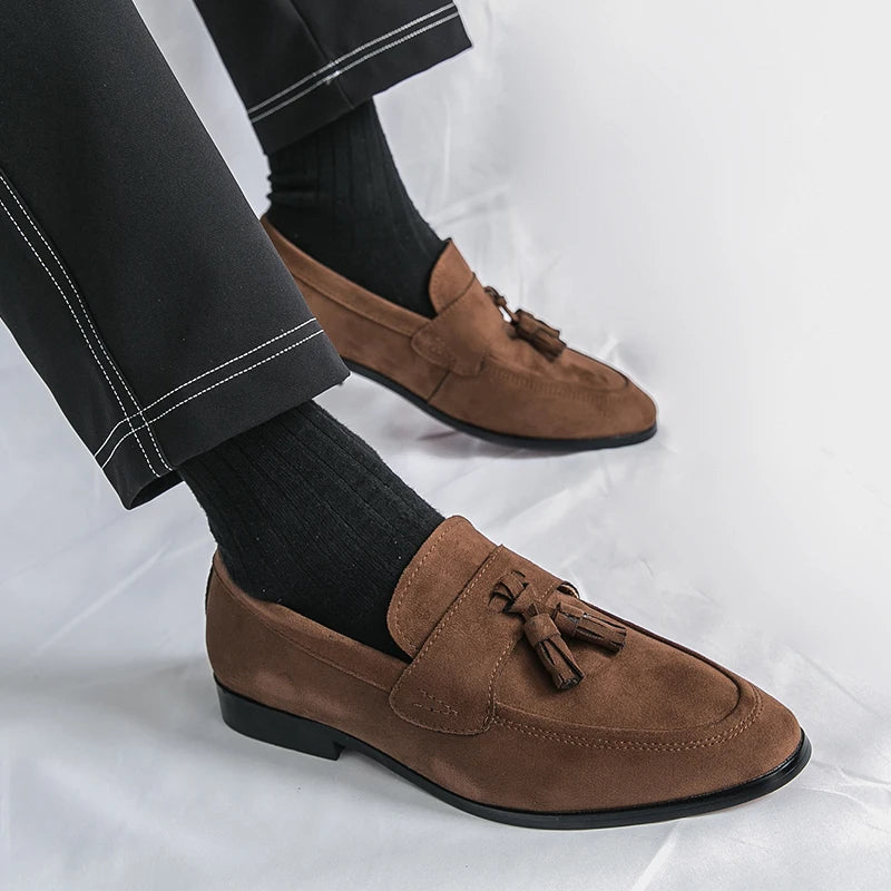 Classic brown leather tassel loafers for men, elegant slip-on footwear for formal and office wear.