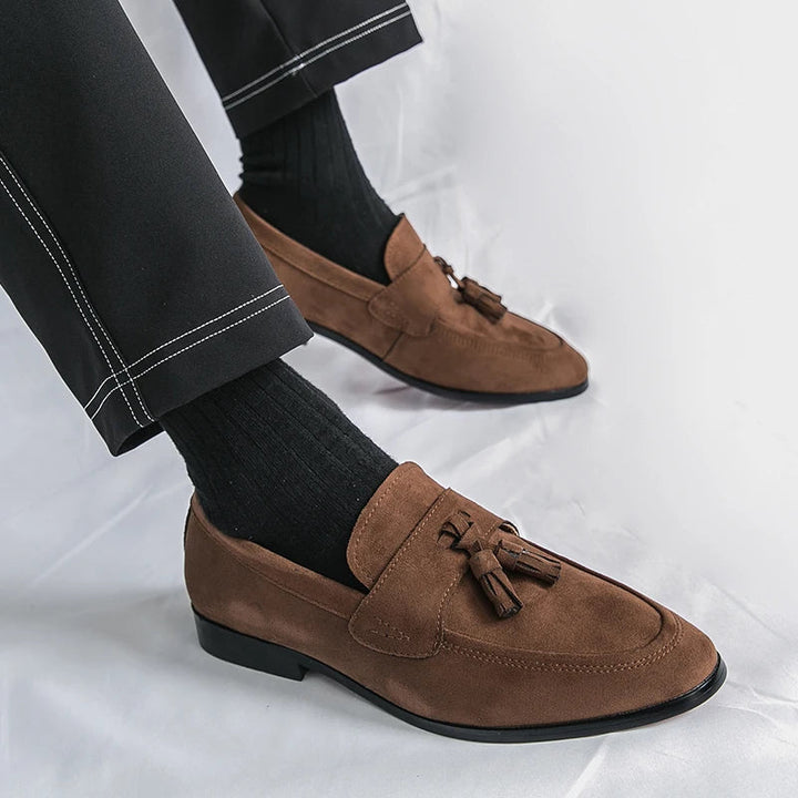 Classic brown leather tassel loafers for men, elegant slip-on footwear for formal and office wear.