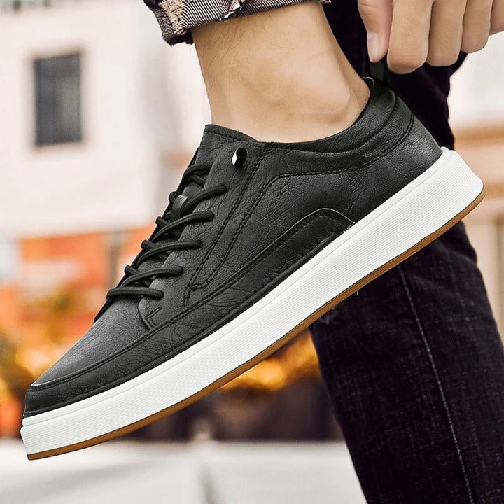 Men's black leather casual shoes, offering supreme comfort and classic style.