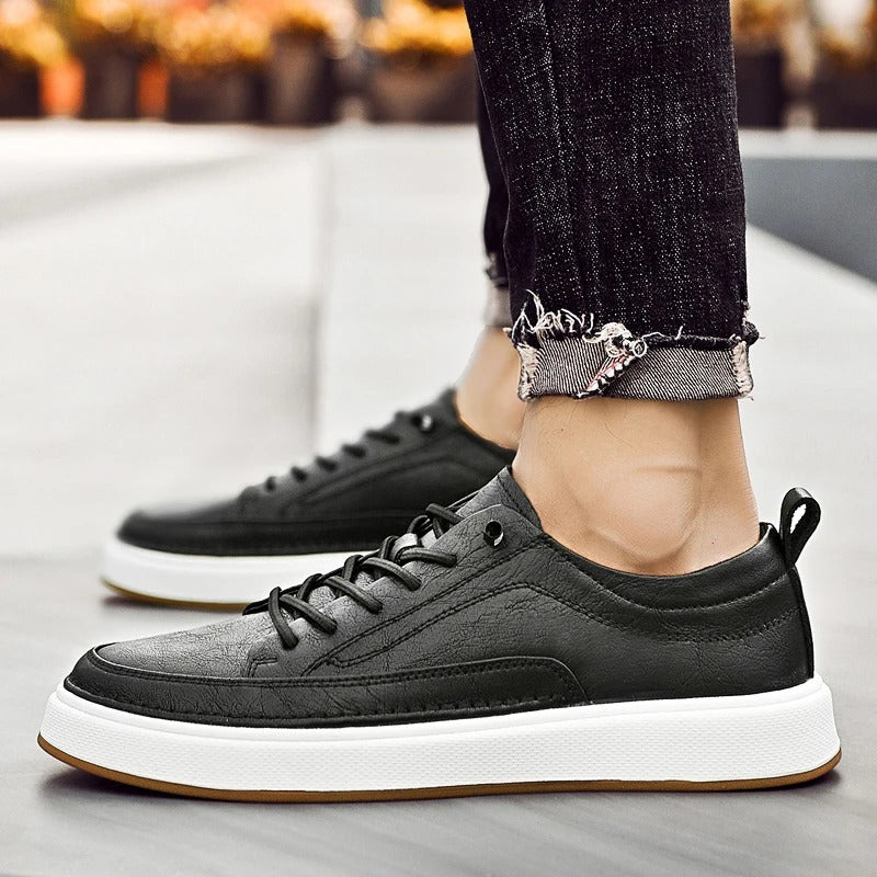 All-day comfort in men's classic black leather sneakers for casual wear.
