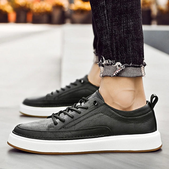 All-day comfort in men's classic black leather sneakers for casual wear.