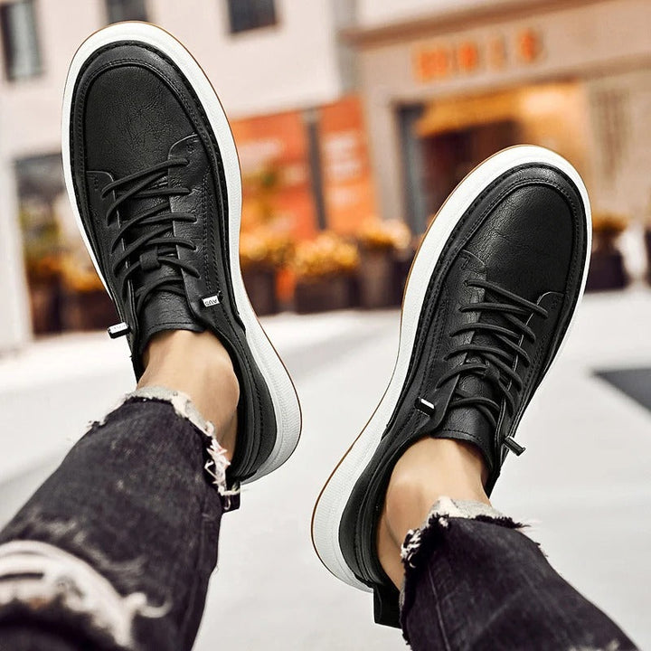 Men's classic black leather footwear, comfortable and stylish for urban adventures.
