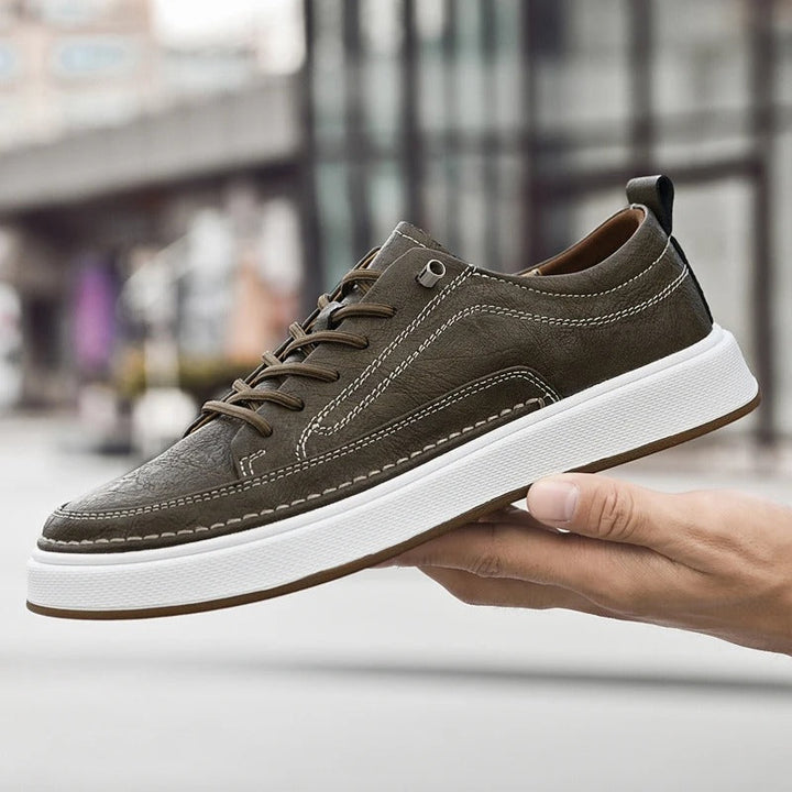Stylish black leather men's sneakers, perfect for casual wear & comfort.