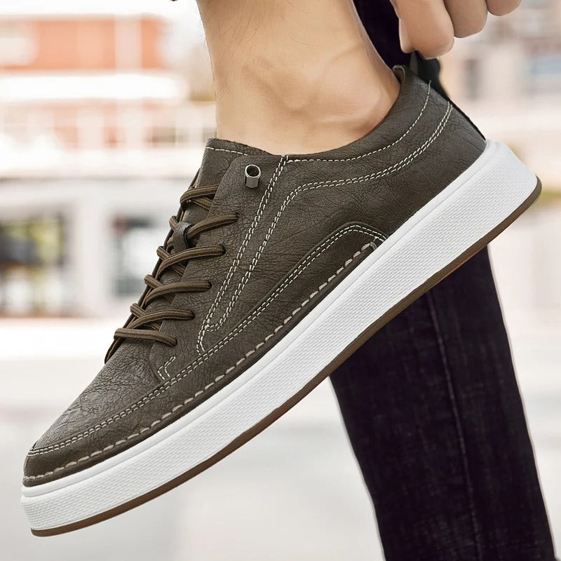 Men's classic brown leather footwear, timeless sneakers for urban comfort.