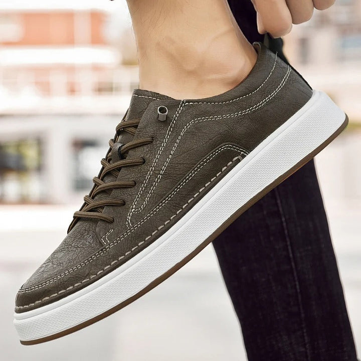 Men's classic brown leather footwear, timeless sneakers for urban comfort.