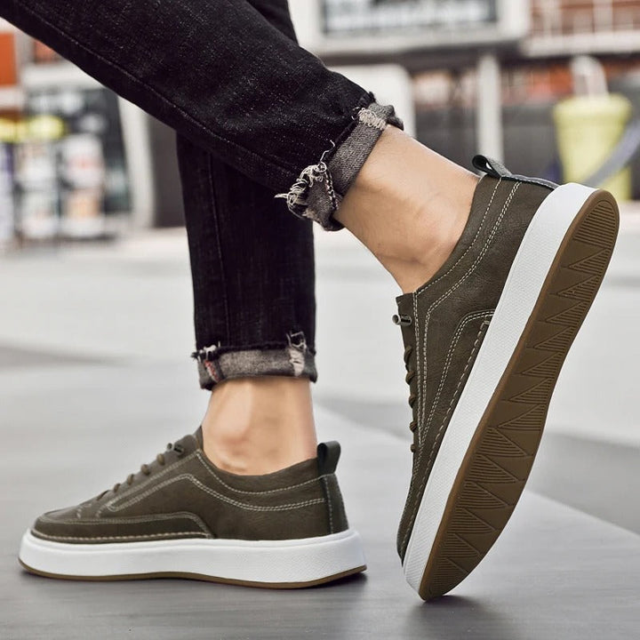 Premium leather men's sneakers in brown, delivering classic comfort & style.