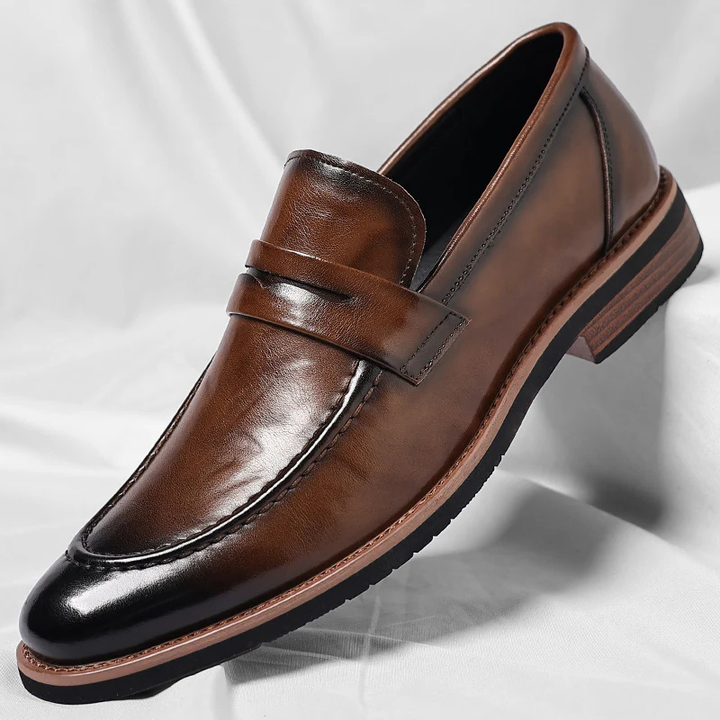 Classic men's brown penny loafers, slip-on style for comfort & versatility, ideal for casual or dress.