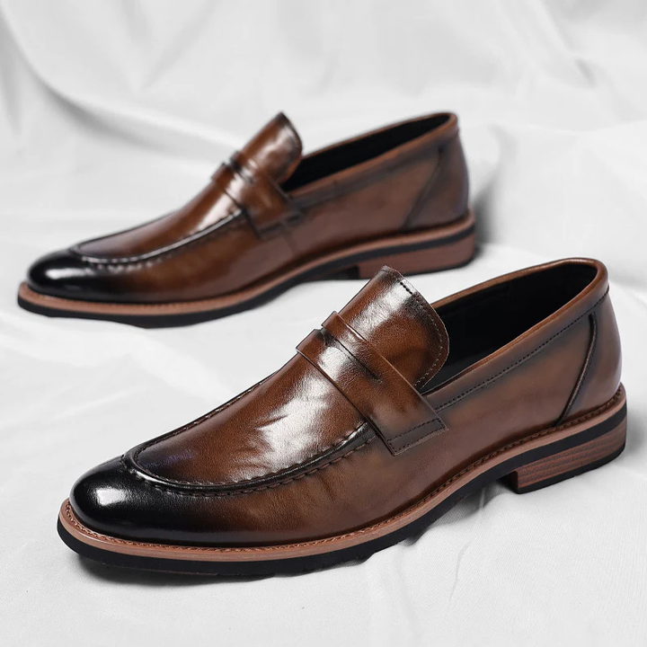 Elegant black leather men's penny loafers, a comfortable slip-on shoe for timeless style.