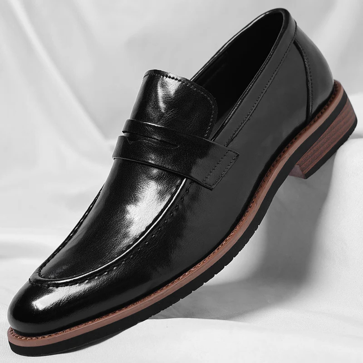 Versatile men's classic penny loafers, a comfortable slip-on dress shoe in rich brown finish.