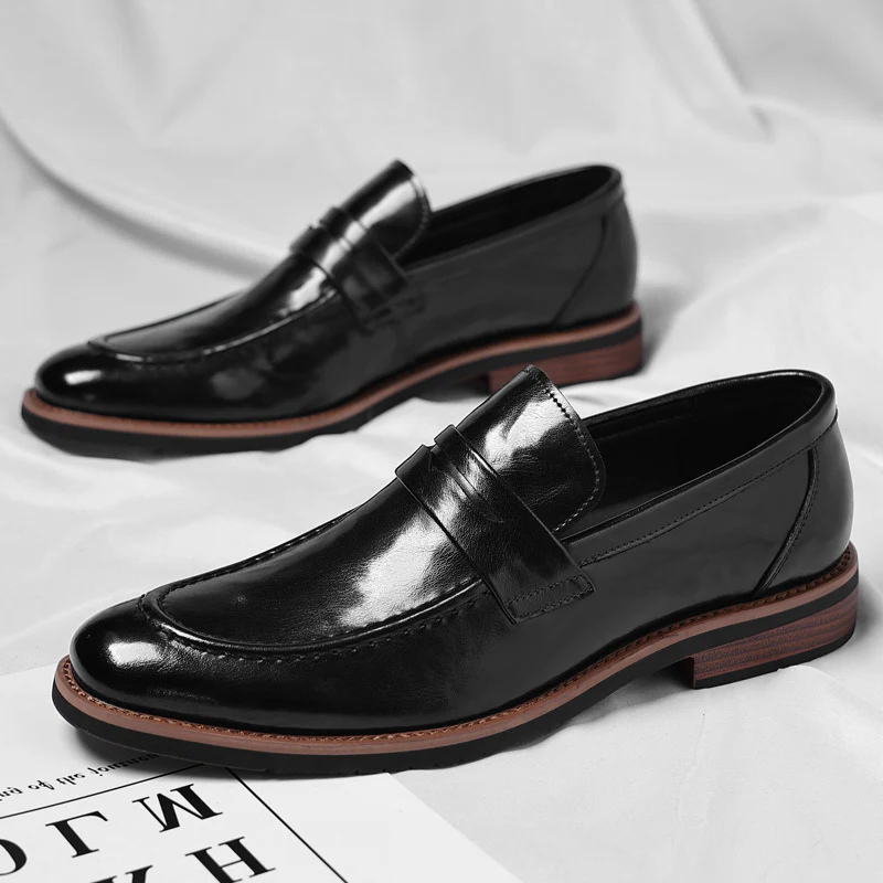 Timeless men's black penny loafers, featuring a comfortable slip-on design for ultimate convenience.