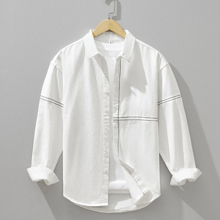 Classic men's button-down shirt, long sleeve, versatile for casual or formal everyday style.