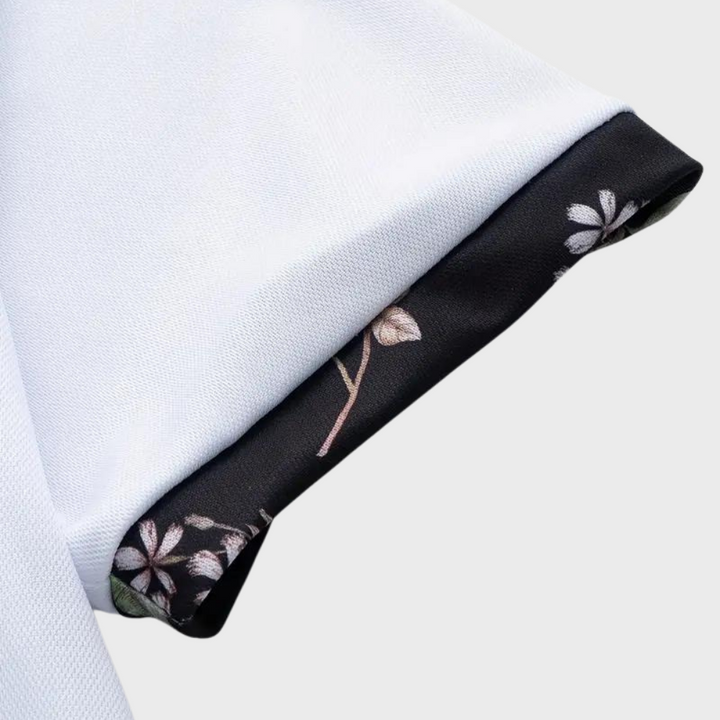 Men's classic cotton polo for summer, featuring a refined subtle floral detail on the placket.