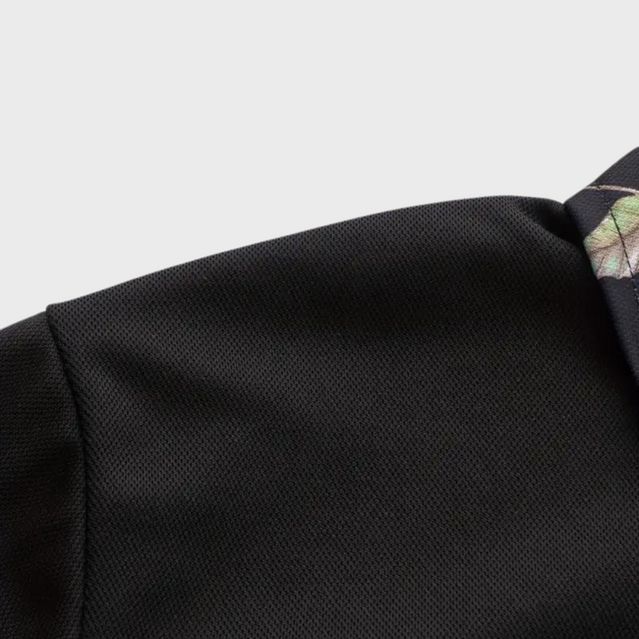 Versatile men's cotton polo shirt with a refined floral trim, great for summer or everyday wear.