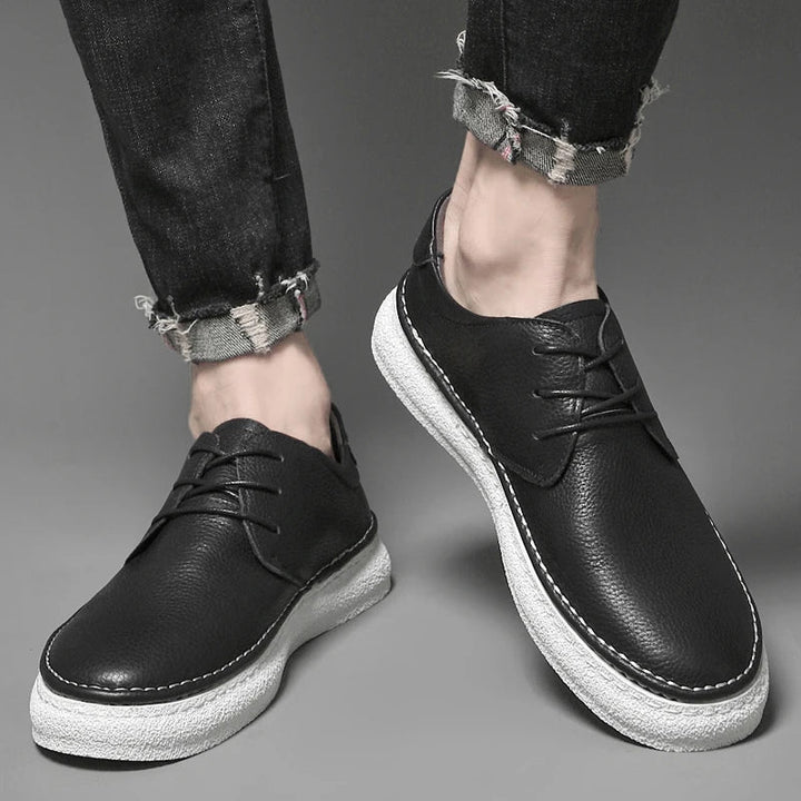 Versatile black men's genuine leather oxford shoes, ideal for dress or smart casual looks.