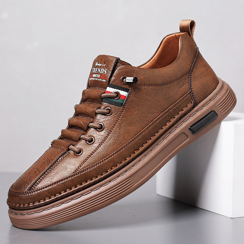 Classic men's low-top sneakers in brown, white & black. Comfortable lace-up casual shoes for everyday wear.